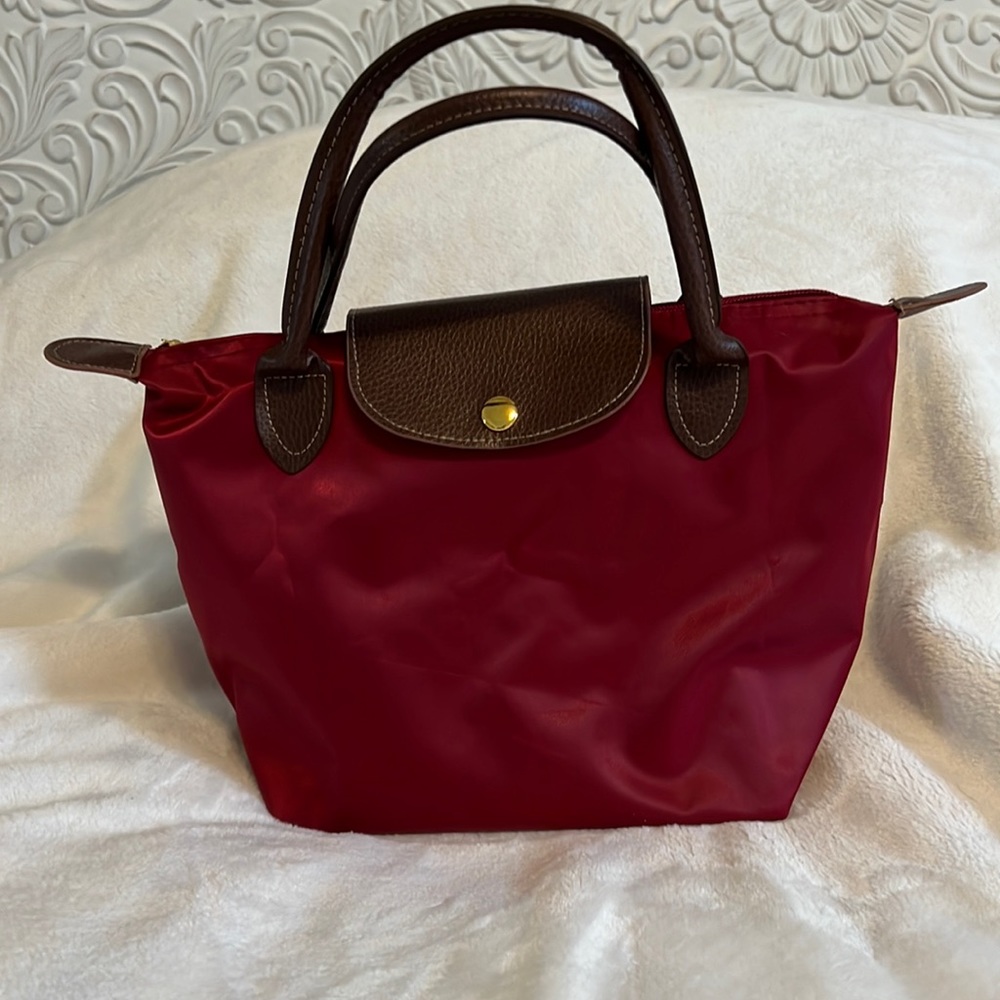 Red nylon bag looks like a Longchamp